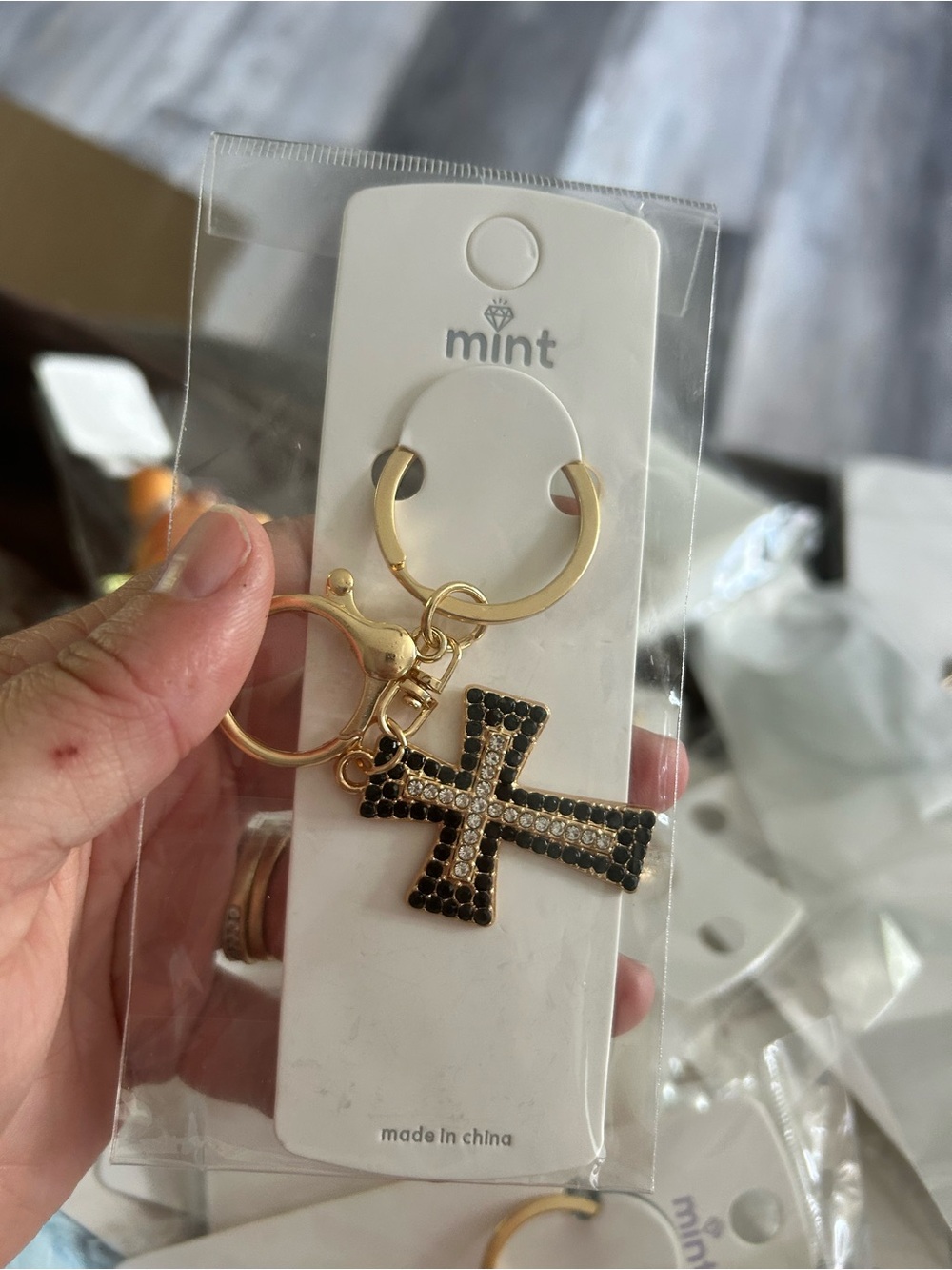 4/$50 Mint Gold Keychain with Black Crystal Cross Charm